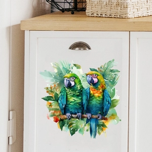 Tropical parrot watercolor wall sticker applied to white cabinet in natural home setting