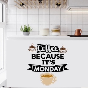 Detail view of coffee wall sticker with typography and cup design on a kitchen wall