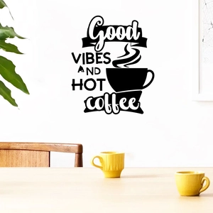 Detail showing Good Vibes and Hot Coffee vinyl wall sticker on a white interior wall