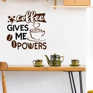 Detail view of coffee gives me powers wall decal with cup and bean motifs on a white wall