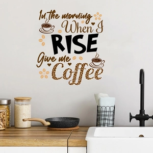 Detail of coffee quote wall sticker on kitchen tiles with illustrated cups and beans
