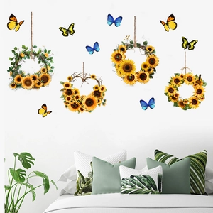 Detail of sunflower wreath wall stickers and colorful butterflies in a bedroom