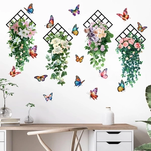 Stickers muraux autocollants avec papillons et roses sur des treillis noirs élégants