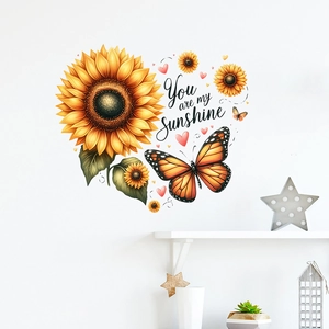 Detail of sunflower and butterfly wall decals with 'You are my Sunshine' text