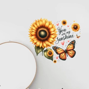 Detail of sunflower and butterfly wall sticker with You are my Sunshine lettering