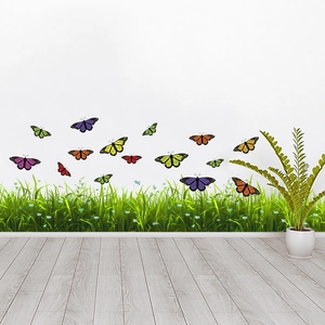 Sticker mural autocollant avec papillons colorés et herbe verte avec fleurs bleues