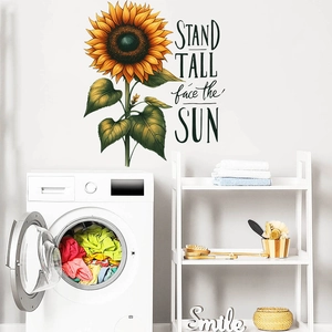 Detail of sunflower wall sticker with Stand Tall face the Sun quote on white wall