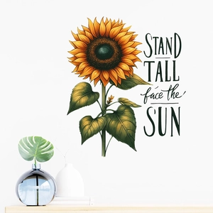 Detail showing sunflower wall sticker with Stand Tall face the Sun quote in a room