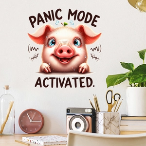 Macro view of cute cartoon pig wall sticker with Panic Mode Activated text on white wall