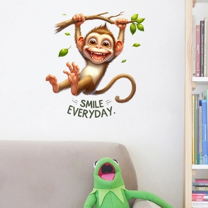 Detail of cartoon monkey wall sticker on branch with Smile Everyday text for nursery