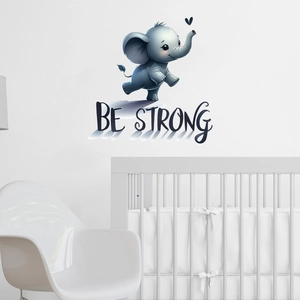 Detail of cute elephant wall sticker with Be Strong text in white nursery room decor