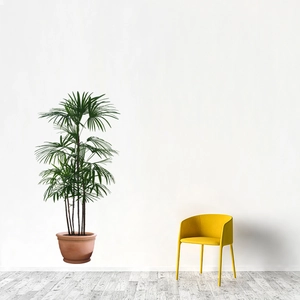 Tropical green palm wall decal with minimalist yellow Nordic armchair home decor