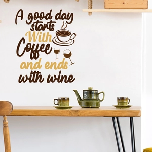 Detail showing the coffee and wine wall sticker on a white kitchen wall with wooden table