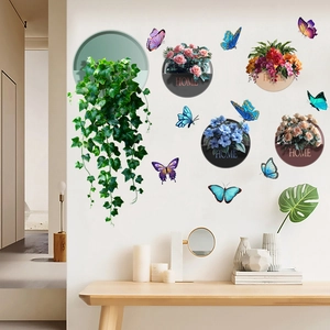 Detail of 3D green ivy leaves and colorful butterfly wall decals with HOME floral motifs
