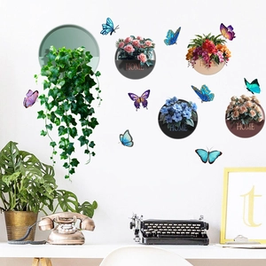 Detail of 3D floral potted plant wall decals and colorful butterflies on white wall
