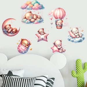 Detailed view of pink hot air balloon and sleeping bear wall stickers on a bedroom wall
