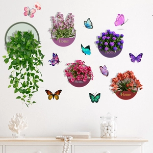 Detail of 3D waterproof wall stickers featuring green plants and colorful butterflies for decor