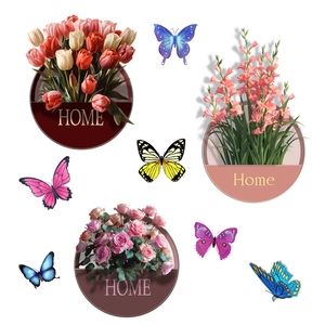 Detail of floral wall stickers with HOME motif, colorful butterflies, and tulips on white