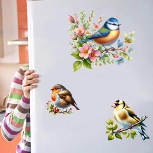 Detail of floral and bird adhesive wall stickers showing realistic magpie and branch designs