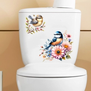 Detailed view of floral bird wall decals applied to a white ceramic toilet surface