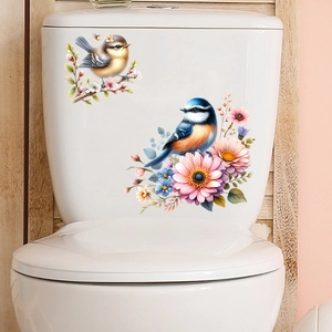 Waterproof watercolor bird and flower wall stickers applied on white ceramic toilet surfaces