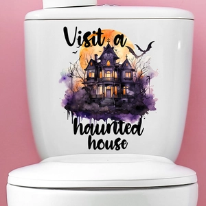 Detail of Halloween ghost castle and pumpkin stickers applied on a white toilet tank