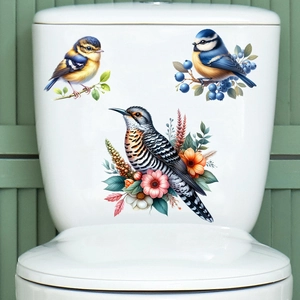 Detail of waterproof wall stickers featuring birds and flowers on a white surface