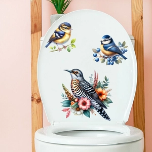 Detailed realistic bird and floral waterproof PVC decals on a white toilet lid surface