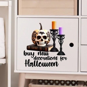 Detail of Halloween stickers featuring pumpkin, candles and books on a white cabinet