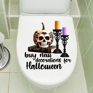 Waterproof Halloween decals featuring pumpkins and candles applied on a white toilet lid