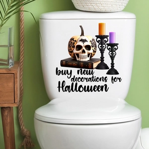 Detail of Halloween ghost and pumpkin waterproof stickers applied on a white toilet tank