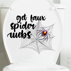 Detail of Halloween toilet sticker featuring a purple spider and web with artistic text