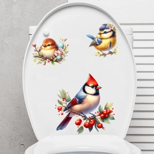 Detail of bird and nest stickers with red cardinal and berries on a white toilet lid
