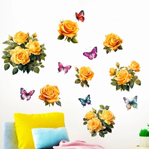 Detailed view of yellow rose and butterfly wall stickers in a cozy living room setup
