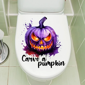 Detail of Halloween toilet lid sticker featuring a purple pumpkin and Carve a pumpkin text