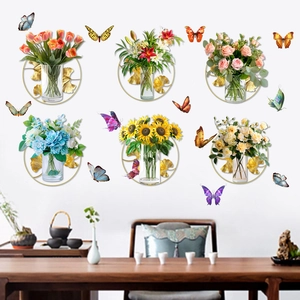 Detail of floral wall decals featuring golden ginkgo leaves and colorful butterflies