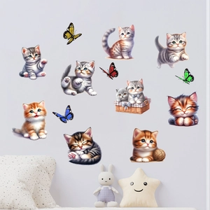 Detailed view of cute cat and butterfly wall stickers in a cozy nursery setting