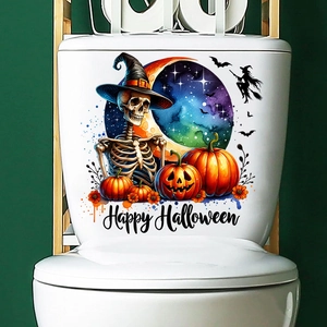 Close-up of Halloween toilet decals featuring a skeleton, pumpkins, and a witch silhouette