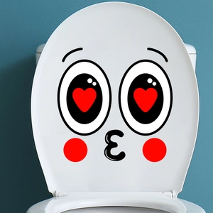 Detail of creative smile emoji toilet sticker with red heart eyes and kissing face