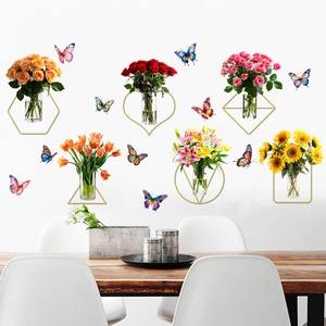 Detail of floral wall stickers with golden geometric frames and colorful butterflies