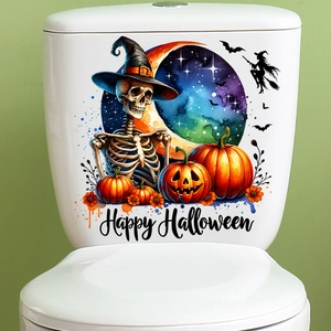 Detail of Halloween toilet stickers with pumpkin, skull, and bat motifs on a white cistern