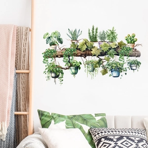 Vivid watercolor wall stickers with hanging plants and stumps on a white living room wall
