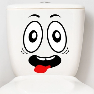 Close-up of waterproof funny cartoon smiley face sticker on white toilet tank decoration