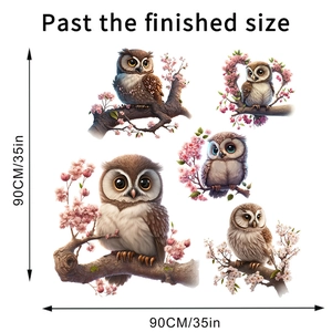 Detail view of owl and cherry blossom wall stickers with 90cm by 90cm finished size