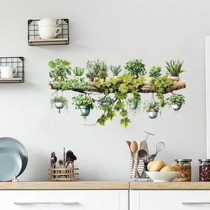 Detail of tropical plant wall stickers with monstera and ivy on a wooden branch
