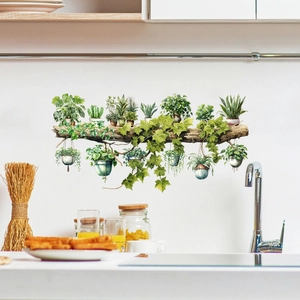 Kitchen scene with watercolor tree branch wall decal and hanging green plant pots