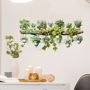 Detail view of tropical plant wall decals with monstera and cactus on a desk background
