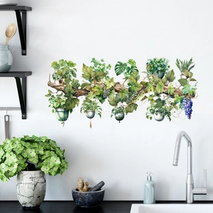 Detail of watercolor plant wall decals with potted greenery and wood vine in a kitchen