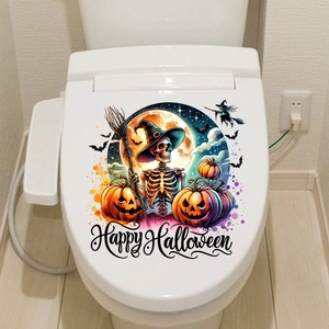 Detail of Halloween toilet lid sticker featuring skull, pumpkin, and bat motifs
