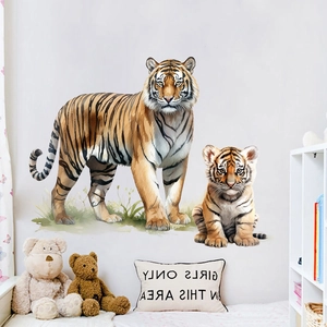 Close-up of realistic tiger wall stickers on a white wall in a cozy nursery setting